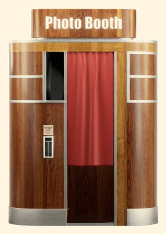 Rounded wooden photo booth with a red curtain and a lit Photo Booth sign